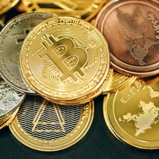 A pile of cryptocurrencies placed on a black background